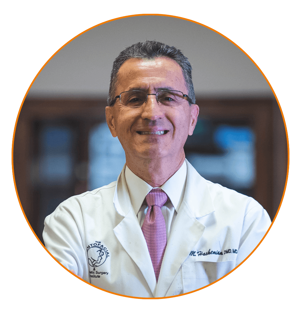 headshot of doctor standing inside of the dental practice