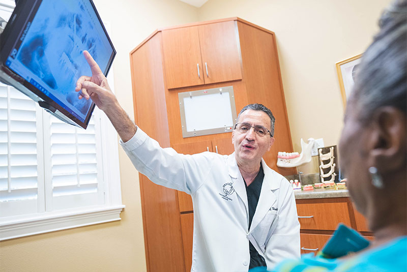patient shoeing display details of the patient dental full mouth implant procedure