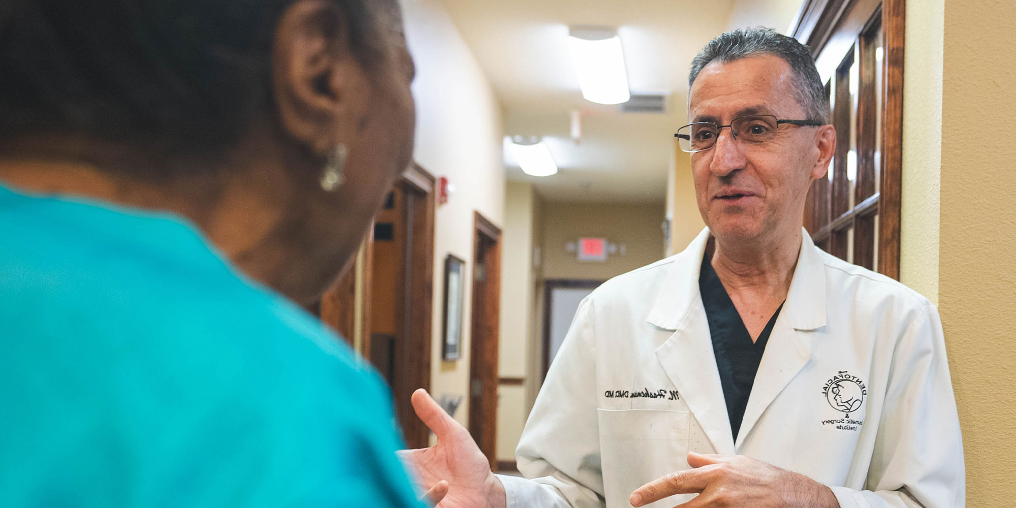 doctor going over dental procedure information with patient