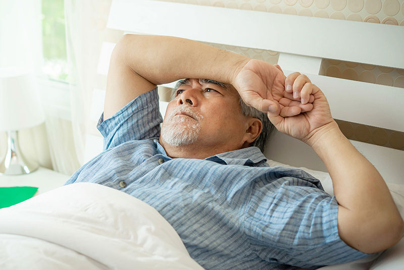 Senior man Suffering in bed cannot sleep from insomnia