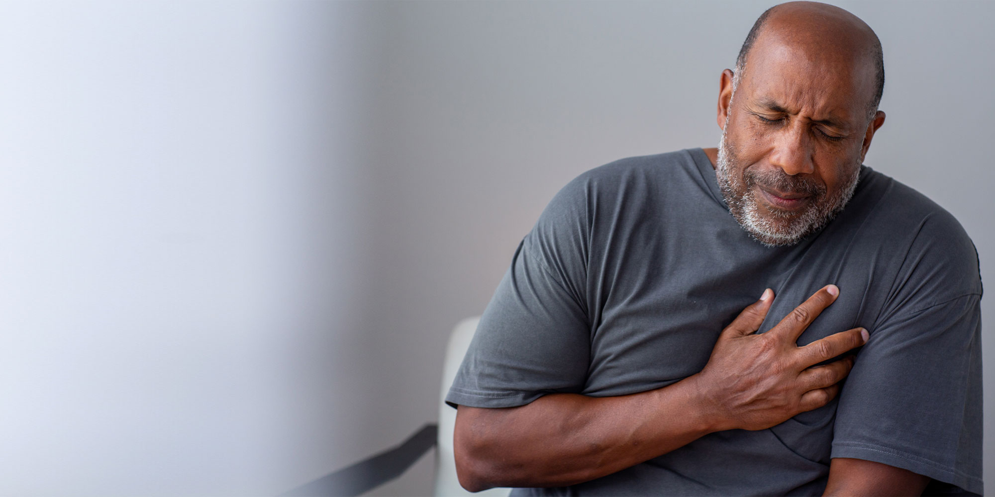 Portrait of an older senior man having chest pain
