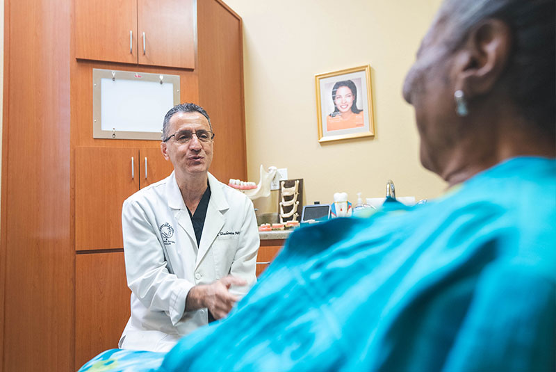doctor going over dental procedure information